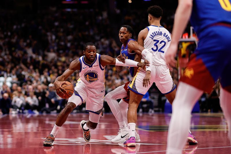 Nov 7, 2025; Denver, Colorado, USA; Golden State Warriors forward Jonathan Kuminga (1) controls the ball as forward Trayce Jackson-Davis (32) screens against Denver Nuggets guard Peyton Watson (8) in the second quarter at Ball Arena. Mandatory Credit: Isaiah J. Downing-Imagn Images