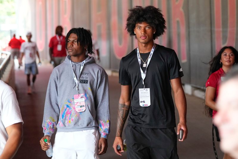 Aug 31, 2024; Columbus, OH, USA; Ohio State Buckeyes recruits Kayden Dixon-Wyatt and Chris Henry Jr. walk onto the field prior to the NCAA football game against the Akron Zips at Ohio Stadium. Ohio State won 52-6.