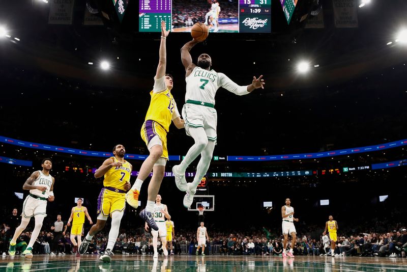 Dec 5, 2025; Boston, Massachusetts, USA; Boston Celtics guard Jaylen Brown (7) goes to the basket against Los Angeles Lakers forward Jake Laravia (12) during the first half at TD Garden. Mandatory Credit: Winslow Townson-Imagn Images