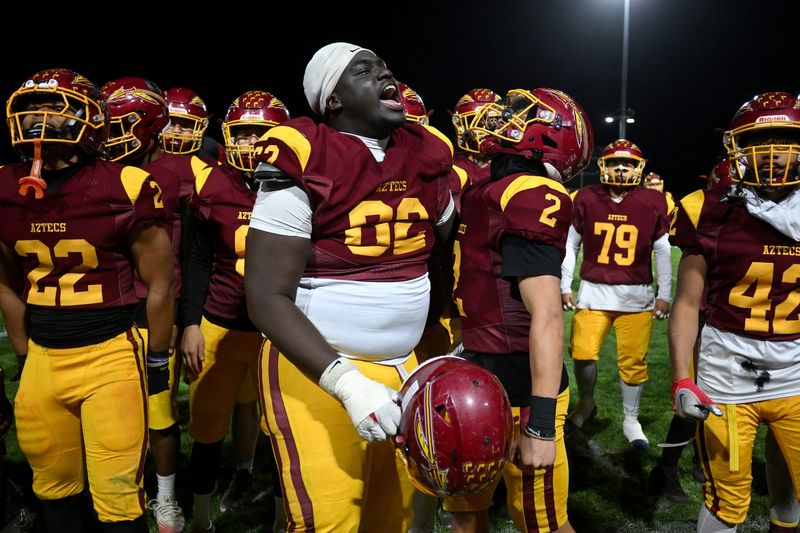 Barstow’s Drelyn Brown leads the Aztecs in a chant after beating Immanuel in the CIF State Division 4AA Southern California regional championship game on Friday, Dec. 5, 2025. The Aztecs pulled off a 13-12 victory.