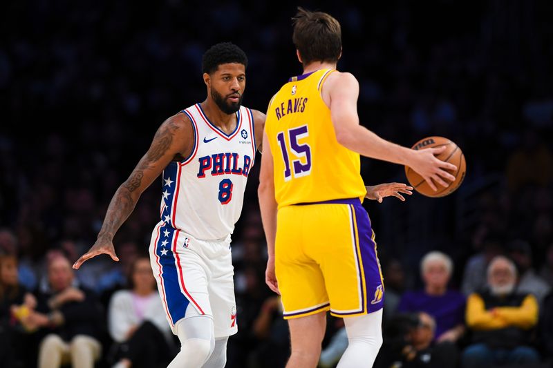 Nov 8, 2024; Los Angeles, California, USA; Philadelphia 76ers forward Paul George (8) defends against Los Angeles Lakers guard Austin Reaves (15) during the first half at Crypto.com Arena. Mandatory Credit: Jonathan Hui-Imagn Images
