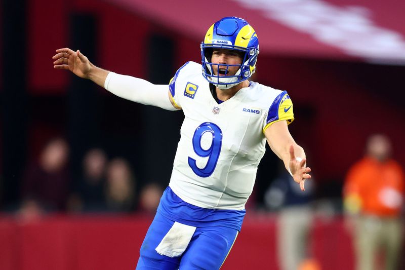 Dec 7, 2025; Glendale, Arizona, USA; Los Angeles Rams quarterback Matthew Stafford (9) reacts against the Arizona Cardinals during the second half at State Farm Stadium. Mandatory Credit: Mark J. Rebilas-Imagn Images
