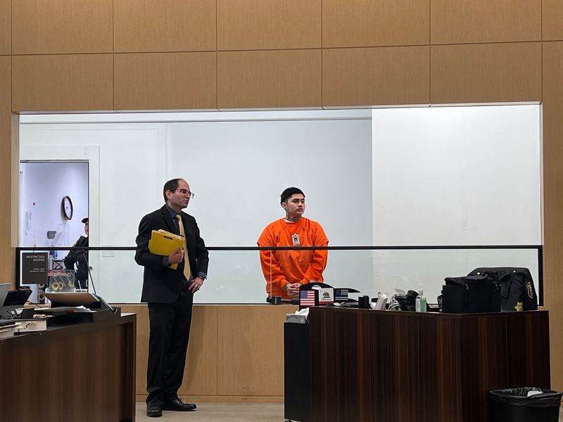 Stockton rapper Luciano Guerrero, who performs as Nano, appears for further arraignment next to his public defender Phillip Krueger at the San Joaquin County Courthouse in downtown Stockton on Thursday, Dec. 11, 2025. He is accused of violating parole.