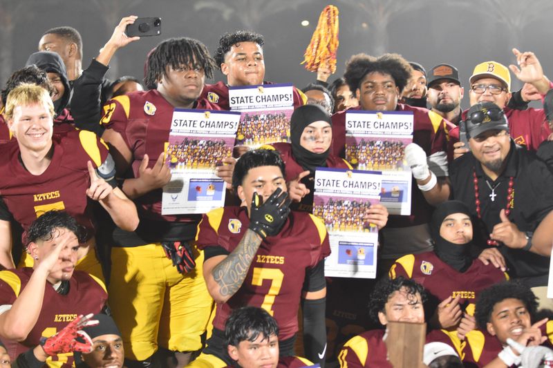 The Barstow football team celebrates after pulling off a 17-7 victory over Sutter on Friday, Dec. 12, 2025, at Buena Park High School to claim the 2025 CIF State Division 4AA championship.