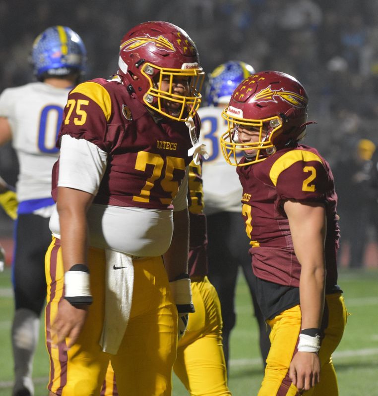 Barstow running back Nicholas Gaoa, right, celebrates with Uriah Stevenson after scoring a touchdown during the 2025 CIF State Division 4AA championship game against Sutter on Friday, Dec. 12, 2025.