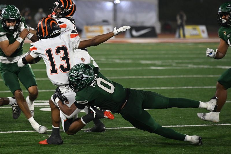 Pacifica's Isaiah Phelps brings down Fresno-Central East's Kevin Cooks during the CIF-State Division 1-A championship bowl on Dec. 13 at Saddleback College in Mission Viejo.