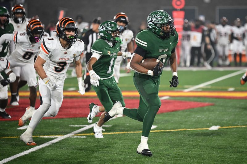 Pacifica's Isaiah Phelps races past Fresno-Central East's Andrew Garcia during the CIF-State Division 1-A championship bowl on Saturday, Dec. 13, at Saddleback College in Mission Viejo. Pacifica lost, 42-28.