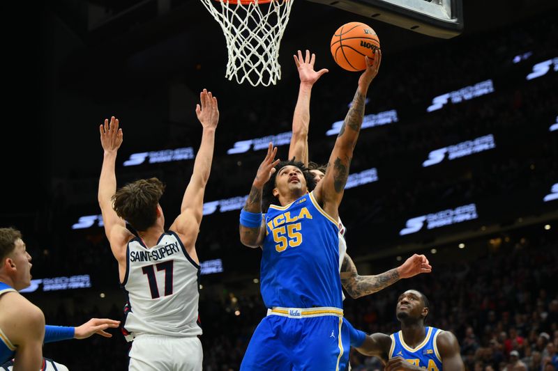 Dec 13, 2025; Seattle, Washington, USA; UCLA Bruins guard Skyy Clark (55) shoots the ball while guarded by Gonzaga Bulldogs guard Mario Saint-Supery (17) during the second half at Climate Pledge Arena. Mandatory Credit: Steven Bisig-Imagn Images