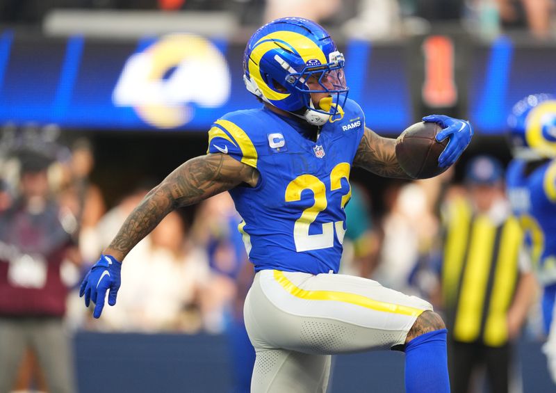 Dec 14, 2025; Inglewood, California, USA; Los Angeles Rams running back Kyren Williams (23) runs for a touchdown during the first quarter against the Detroit Lions at SoFi Stadium. Mandatory Credit: Kirby Lee-Imagn Images
