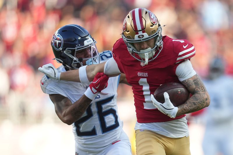 Dec 14, 2025; Santa Clara, California, USA; San Francisco 49ers wide receiver Ricky Pearsall (1) stiff arms Tennessee Titans cornerback Marcus Harris (26) during the third quarter at Levi's Stadium. Mandatory Credit: Cary Edmondson-Imagn Images