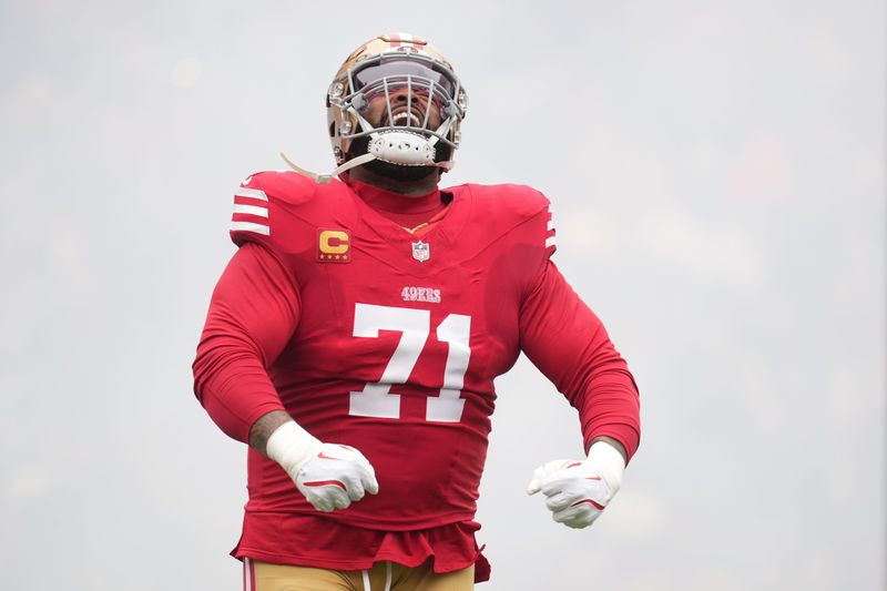 Dec 14, 2025; Santa Clara, California, USA; San Francisco 49ers offensive tackle Trent Williams (71) enters the field prior to the first half against the Tennessee Titans at Levi's Stadium. Mandatory Credit: Cary Edmondson-Imagn Images