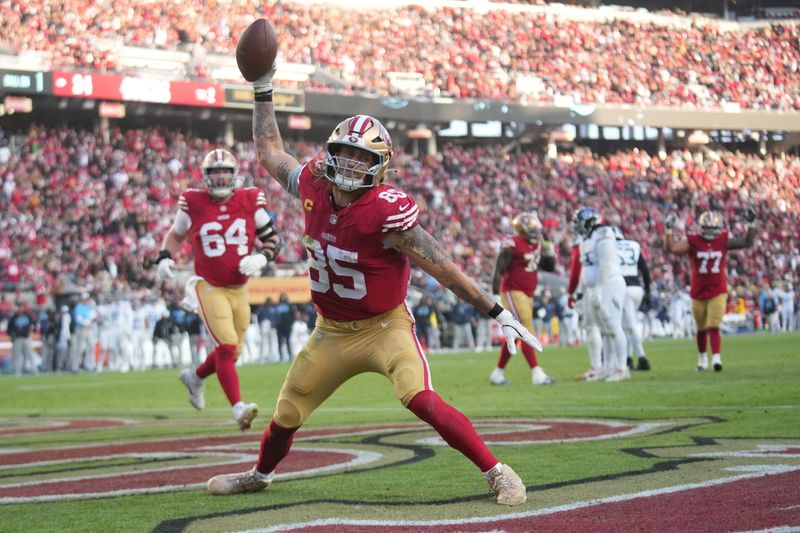 Dec 14, 2025; Santa Clara, California, USA; San Francisco 49ers tight end George Kittle (85) scores a touchdown during the third quarter against the Tennessee Titans at Levi's Stadium. Mandatory Credit: Cary Edmondson-Imagn Images