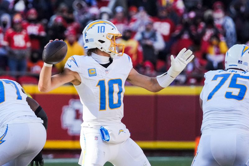 Dec 14, 2025; Kansas City, Missouri, USA; Los Angeles Chargers quarterback Justin Herbert (10) passes against the Kansas City Chiefs during the second quarter at GEHA Field at Arrowhead Stadium. Mandatory Credit: Denny Medley-Imagn Images