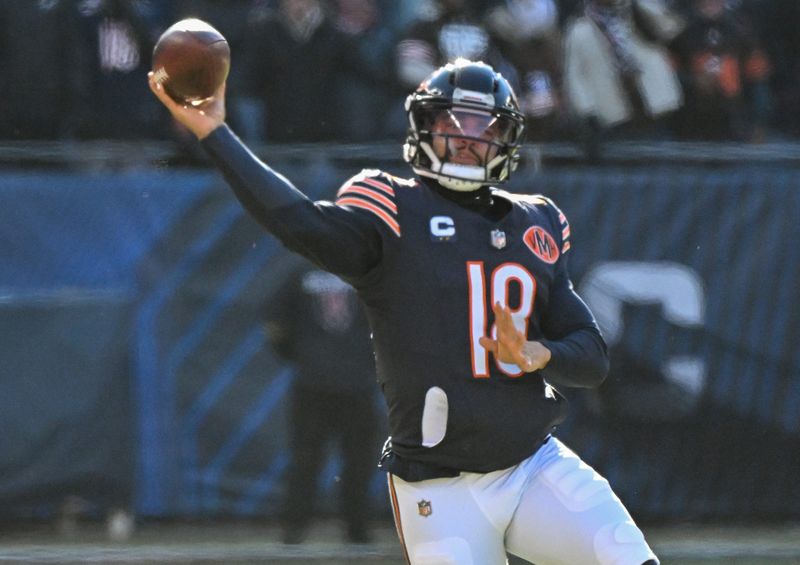 Dec 14, 2025; Chicago, Illinois, USA; Chicago Bears quarterback Caleb Williams (18) throws a pass during the first quarter against the Cleveland Browns at Soldier Field. Mandatory Credit: Matt Marton-Imagn Images