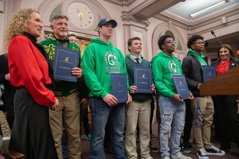 Mayor Christina Fugazi, left, recognizes head coach Tony Franks and the St. Mary’s High School varsity football team during a council meeting at Stockton City Hall in downtown Stockton on Dec. 16, 2025, for winning the CIF Div. 2-AA State football championship.