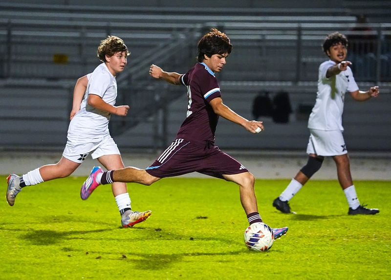Rancho Mirage's Emilio Lucio readies a shot while sprinting down the pitch during the second half of their game in Rancho Mirage, Calif., Tuesday, Dec. 16, 2025.
