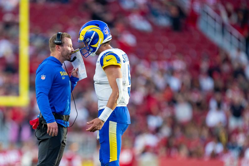 November 9, 2025; Santa Clara, California, USA; Los Angeles Rams head coach Sean McVay talks with quarterback Matthew Stafford (9) during the fourth quarter against the San Francisco 49ers at Levi's Stadium. Mandatory Credit: Kyle Terada-Imagn Images