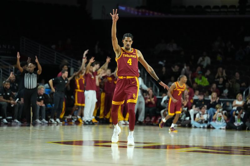 Dec 17, 2025; Los Angeles, California, USA; Southern California Trojans forward Chad Baker-Mazara (4) celebrates against the UTSA Roadrunners in the first half at Galen Center. Mandatory Credit: Kirby Lee-Imagn Images