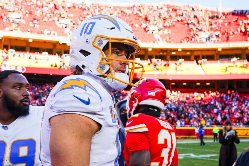 Dec 14, 2025; Kansas City, Missouri, USA; Los Angeles Chargers quarterback Justin Herbert (10) walks to the locker room following a victory against the Kansas City Chiefs at GEHA Field at Arrowhead Stadium. Mandatory Credit: Denny Medley-Imagn Images