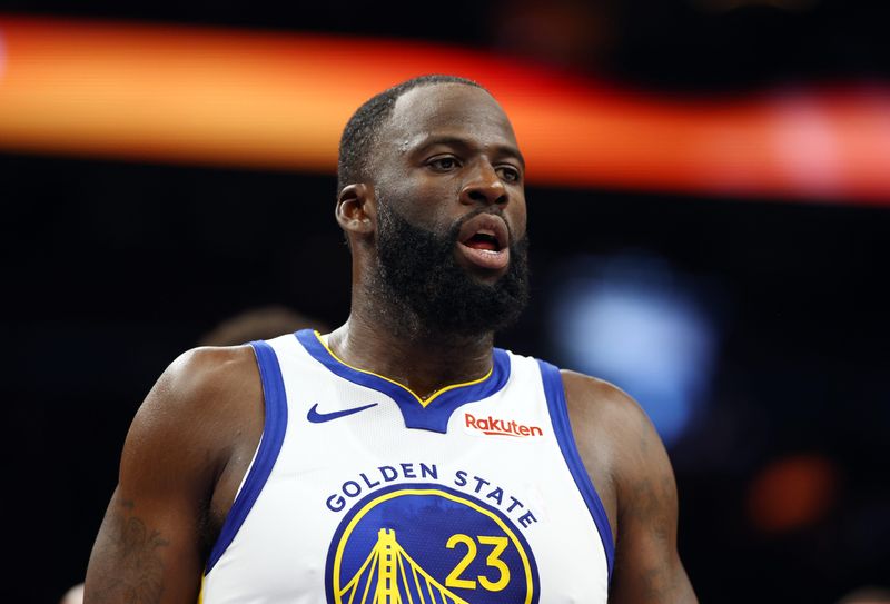 Dec 18, 2025; Phoenix, Arizona, USA; Golden State Warriors forward Draymond Green (23) against the Phoenix Suns at Mortgage Matchup Center. Mandatory Credit: Mark J. Rebilas-Imagn Images
