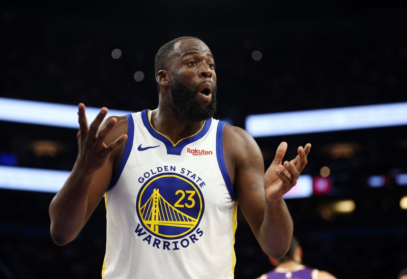 Dec 18, 2025; Phoenix, Arizona, USA; Golden State Warriors forward Draymond Green (23) reacts against the Phoenix Suns in the second half at Mortgage Matchup Center. Mandatory Credit: Mark J. Rebilas-Imagn Images