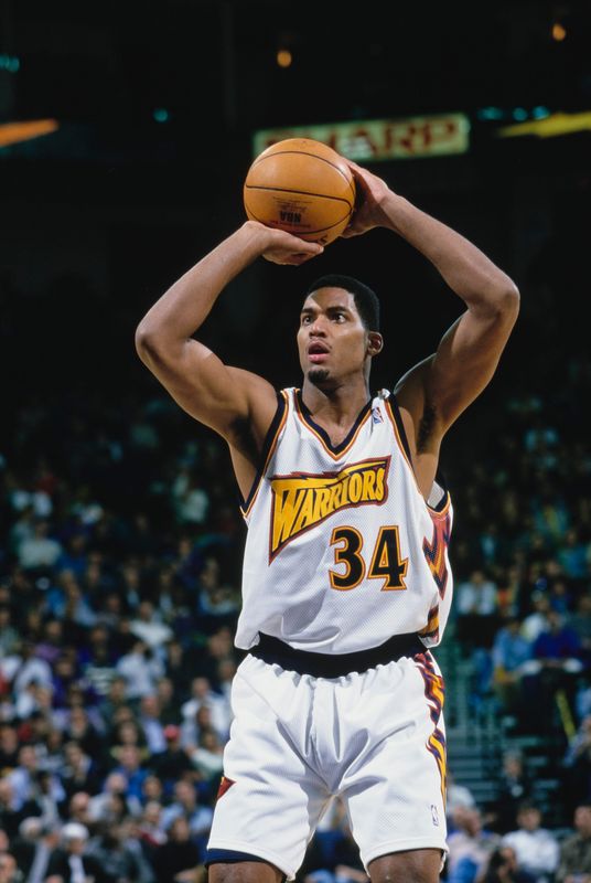 David Vaughn #34, Power Forward for the Golden State Warriors prepares to shoot a free throw during the NBA Pacific Division basketball game against the Charlotte Hornets on 10th December 1997 at The Arena in Oakland, California, United States., United States. The Golden State Warriors won the game 93 - 92. (Photo by Todd Warshaw/Allsport/Getty Images)