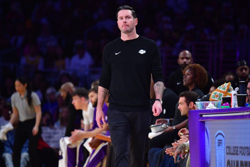 Dec 25, 2025; Los Angeles, California, USA; Los Angeles Lakers head coach JJ Redick watches game action against the Houston Rockets during the first half at Crypto.com Arena. Mandatory Credit: Gary A. Vasquez-Imagn Images