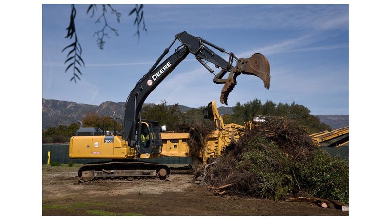 Ojai Valley Organics loader and grinder gets to work at the grand opening March 10. The site allows Christmas tree recyclers to fill a bag with mulch or compost or to receive a half-cubic-yard scoop into truck beds.
