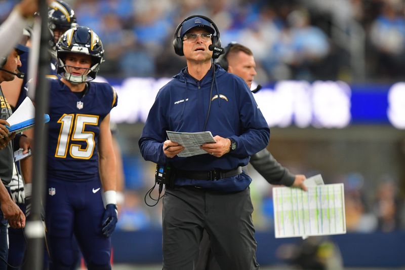 Dec 27, 2025; Inglewood, California, USA; Los Angeles Chargers head coach Jim Harbaugh looked on from the sidelines against the Houston Texans during the second half at SoFi Stadium. Mandatory Credit: Gary A. Vasquez-Imagn Images