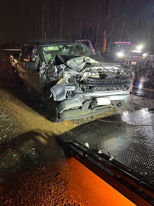 A worker helping divert traffic on Dec. 22, 2025, during floods on Highway 273 barely escaped being hit by a vehicle before the motorist crashed it into the worker's truck, Caltrans announced Monday.