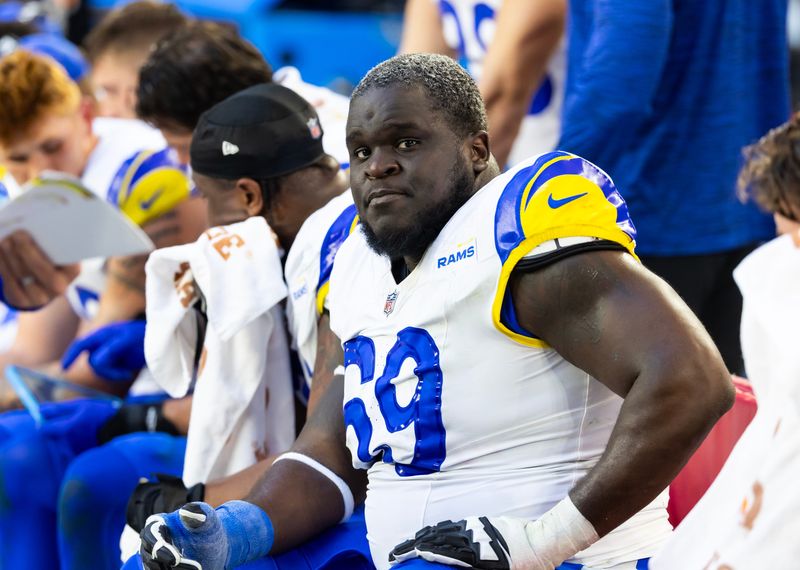 Dec 7, 2025; Glendale, Arizona, USA; Los Angeles Rams offensive lineman Kevin Dotson (69) against the Arizona Cardinals at State Farm Stadium. Mandatory Credit: Mark J. Rebilas-Imagn Images