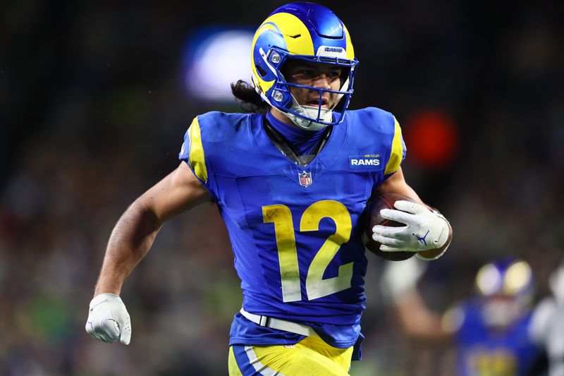 Dec 18, 2025; Seattle, Washington, USA; Los Angeles Rams wide receiver Puka Nacua (12) runs for a touchdown against the Seattle Seahawks in overtime at Lumen Field. Mandatory Credit: Kevin Ng-Imagn Images