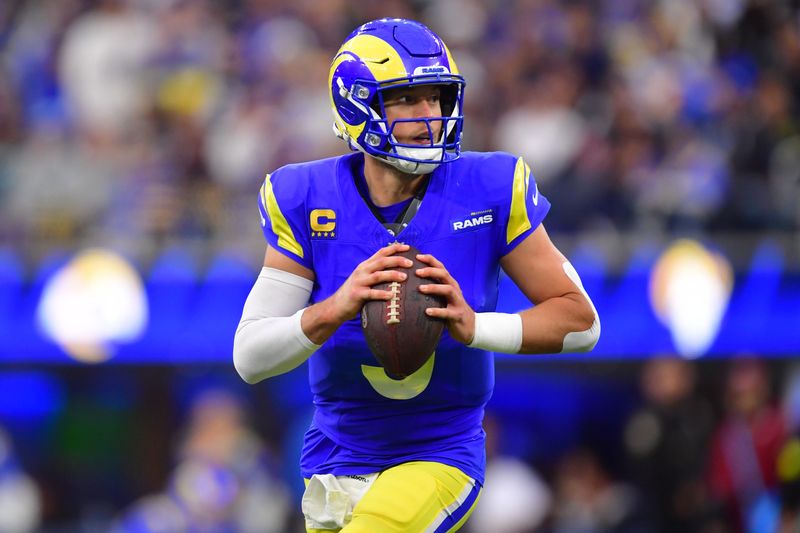 Jan 4, 2026; Inglewood, California, USA; Los Angeles Rams quarterback Matthew Stafford (9) looks downfield against the Arizona Cardinals during the second half at SoFi Stadium. Mandatory Credit: Gary A. Vasquez-Imagn Images