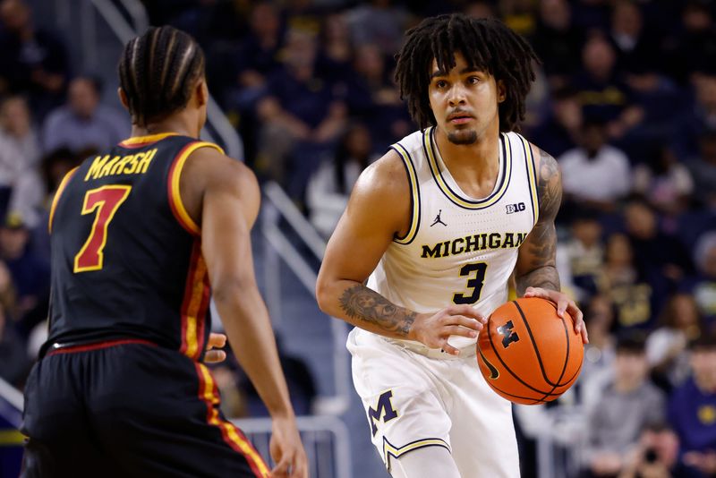 Jan 2, 2026; Ann Arbor, Michigan, USA; Michigan Wolverines guard Elliot Cadeau (3) dribbles defended by Southern California Trojans guard Jordan Marsh (7) in the first half at Crisler Center. Mandatory Credit: Rick Osentoski-Imagn Images