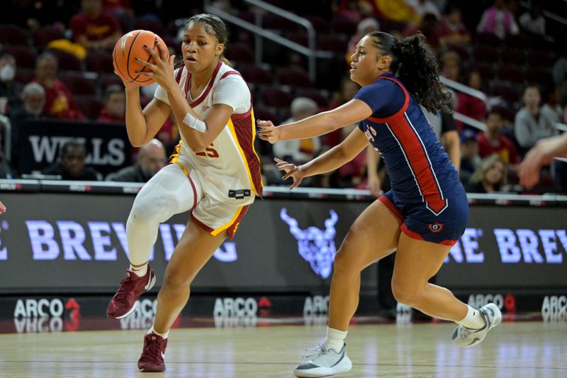 Dec 2, 2025; Los Angeles, California, USA; Saint Mary's Gaels guard Malia Latu (13) defends USC Trojans guard Kara Dunn (25) during the first half at Galen Center. Mandatory Credit: Jayne Kamin-Oncea-Imagn Images