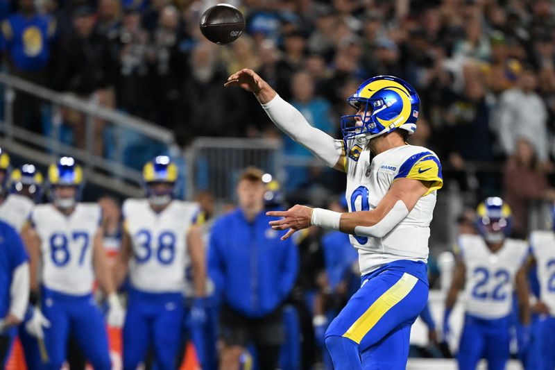 Jan 10, 2026; Charlotte, NC, USA; Los Angeles Rams quarterback Matthew Stafford (9) drops back to pass against the Carolina Panthers in the first half during the NFC Wild Card Round game at Bank of America Stadium. Mandatory Credit: Bob Donnan-Imagn Images