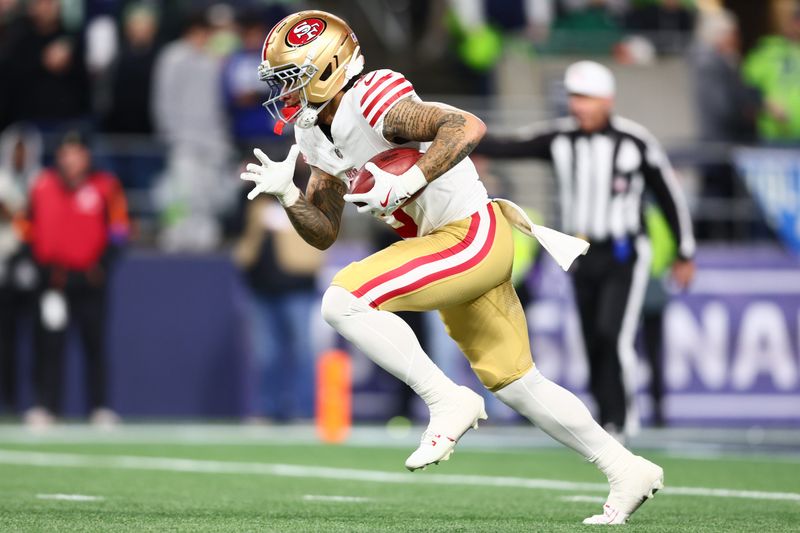 Jan 17, 2026; Seattle, WA, USA; San Francisco 49ers wide receiver Skyy Moore (9) returns a kickoff against the Seattle Seahawks during the second half in an NFC Divisional Round game at Lumen Field. Mandatory Credit: Kevin Ng-Imagn Images
