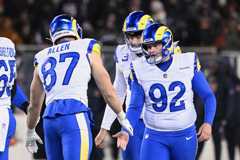 Jan 18, 2026; Chicago, IL, USA; Los Angeles Rams placekicker Harrison Mevis (92) shakes hands with tight end Davis Allen (87) after kicking a thirty-two yard field goal against the Chicago Bears during the second quarter of an NFC Divisional Round game at Soldier Field. Mandatory Credit: Matt Marton-Imagn Images