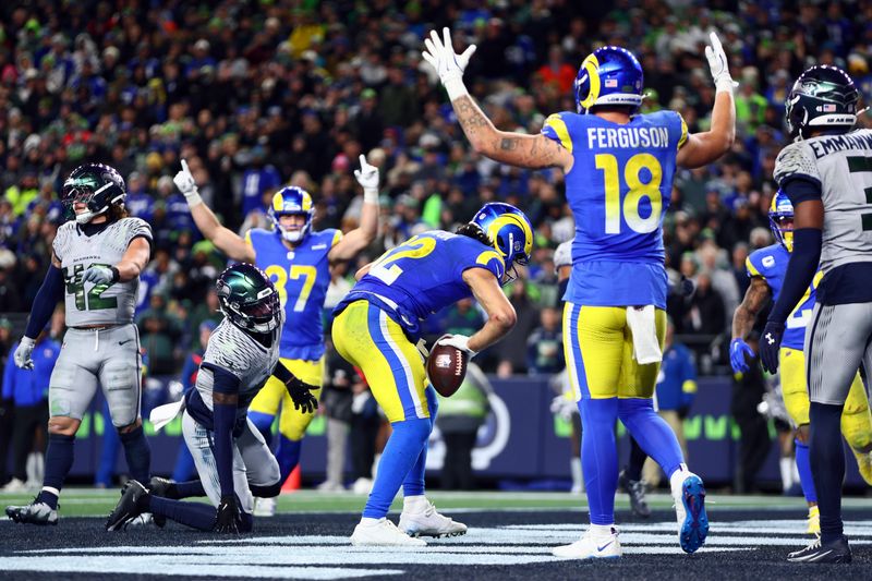 Dec 18, 2025; Seattle, Washington, USA; Los Angeles Rams wide receiver Puka Nacua (12) celebrates with teammates after a touchdown against the Seattle Seahawks in the second half at Lumen Field. Mandatory Credit: Kevin Ng-Imagn Images