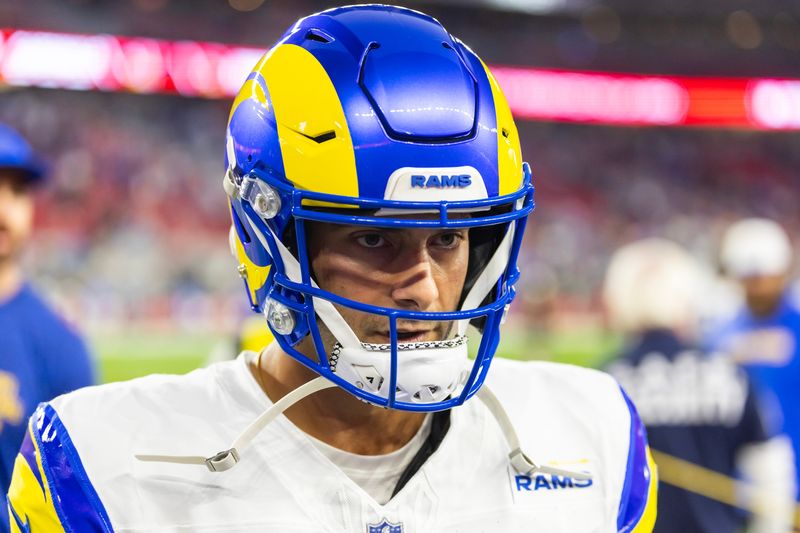 Dec 7, 2025; Glendale, Arizona, USA; Los Angeles Rams quarterback Jimmy Garoppolo (11) against the Arizona Cardinals at State Farm Stadium. Mandatory Credit: Mark J. Rebilas-Imagn Images