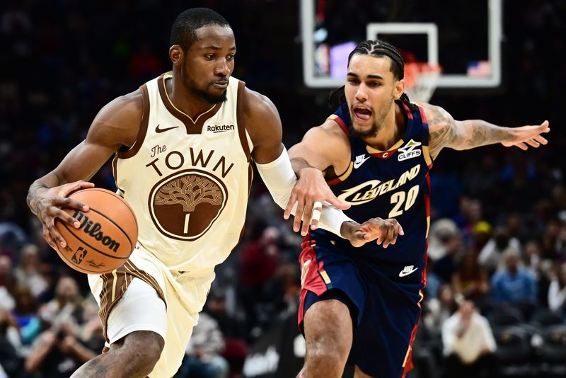 Dec 6, 2025; Cleveland, Ohio, USA; Golden State Warriors forward Jonathan Kuminga (1) drives to the basket against Cleveland Cavaliers guard Jaylon Tyson (20) during the second half at Rocket Arena. Mandatory Credit: Ken Blaze-Imagn Images