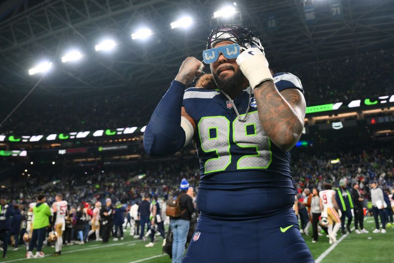 Jan 17, 2026; Seattle, WA, USA; Seattle Seahawks defensive end Leonard Williams (99) celebrates on the field following an NFC Divisional Round game against the San Francisco 49ers at Lumen Field. Mandatory Credit: Steven Bisig-Imagn Images