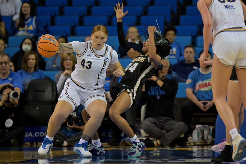 Jan 21, 2026; Los Angeles, California, USA; UCLA Bruins guard Megan Grant (43) is charged with a foul on Purdue Boilermakers guard Tara Daye (44) in the second half at Pauley Pavilion presented by Wescom Financial. Mandatory Credit: Jayne Kamin-Oncea-Imagn Images