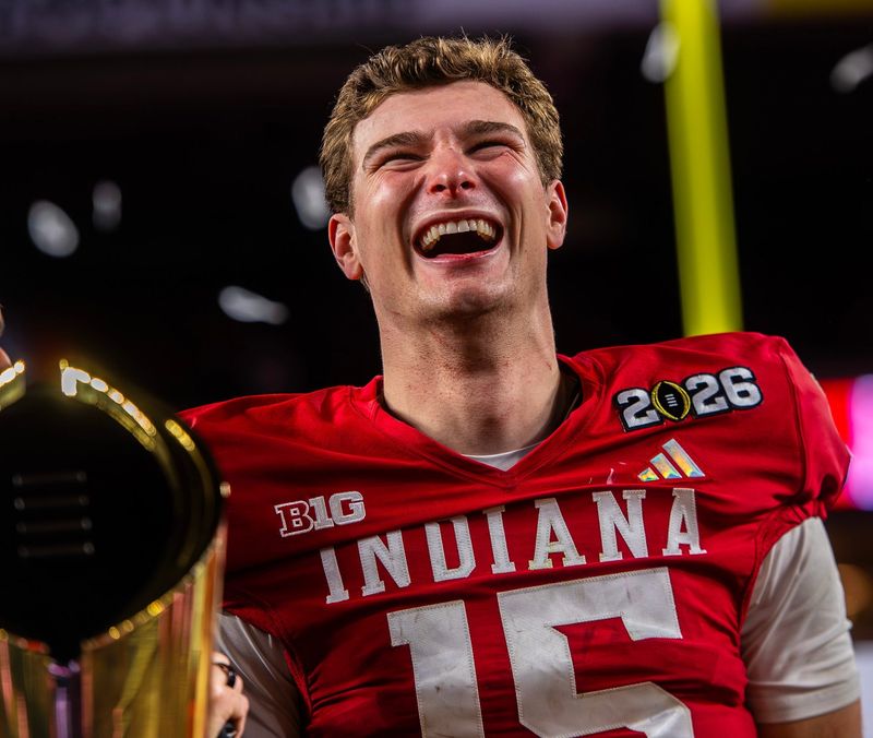 Indiana's Fernando Mendoza (15) smiles on the podium after the College Football Playoff National Championship college football game at Hard Rock Stadium in Miami Gardens on Monday, Jan. 19, 2026.