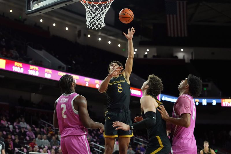 Jan 21, 2026; Los Angeles, California, USA; Northwestern Wildcats forward Tre Singleton (8) shoots the ball against Southern California Trojans forward Ezra Ausar (2) in the first half at Galen Center. Mandatory Credit: Kirby Lee-Imagn Images