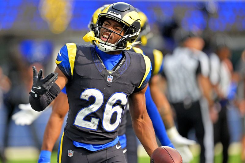 Nov 16, 2025; Inglewood, California, USA; Los Angeles Rams safety Kamren Kinchens (26) celebrates after a interception during the first quarter against the Seattle Seahawks at SoFi Stadium. Mandatory Credit: Jayne Kamin-Oncea-Imagn Images