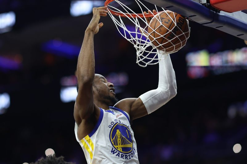 Dec 4, 2025; Philadelphia, Pennsylvania, USA; Golden State Warriors forward Jonathan Kuminga (1) dunks the ball against the Philadelphia 76ers during the third quarter at Xfinity Mobile Arena. Mandatory Credit: Bill Streicher-Imagn Images