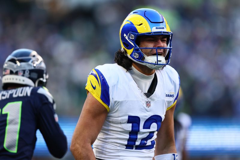 Jan 25, 2026; Seattle, WA, USA; Los Angeles Rams wide receiver Puka Nacua (12) reacts after a catch against the Seattle Seahawks during the first half in the 2026 NFC Championship Game at Lumen Field. Mandatory Credit: Kevin Ng-Imagn Images