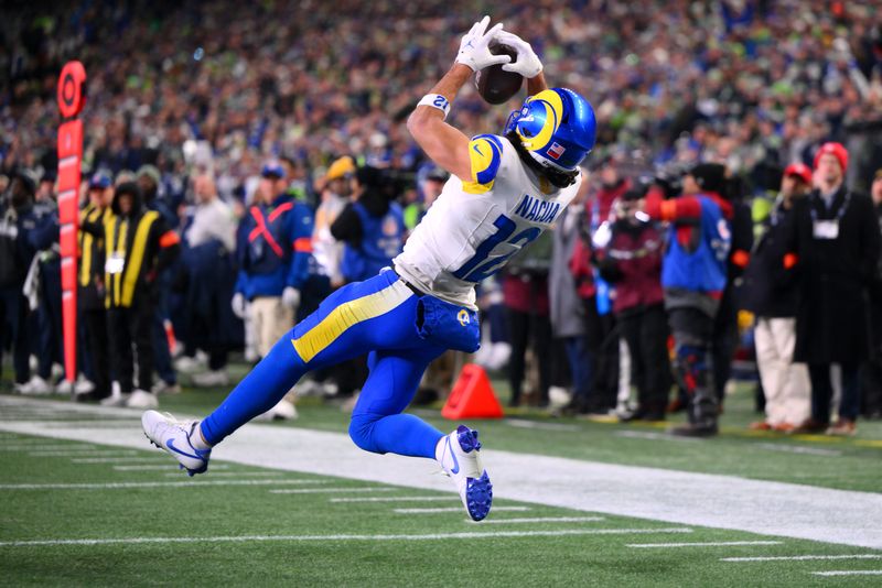 Jan 25, 2026; Seattle, WA, USA; Los Angeles Rams wide receiver Puka Nacua (12) scores a touchdown against the Seattle Seahawks during the second half in the 2026 NFC Championship Game at Lumen Field. Mandatory Credit: Steven Bisig-Imagn Images