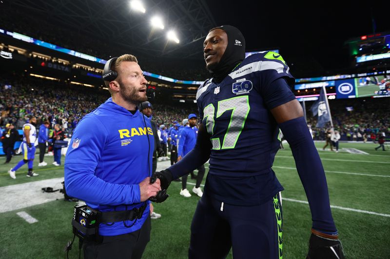 Jan 25, 2026; Seattle, WA, USA; Los Angeles Rams head coach Sean McVay greets Seattle Seahawks cornerback Riq Woolen (27) after the 2026 NFC Championship Game at Lumen Field. Mandatory Credit: Kevin Ng-Imagn Images